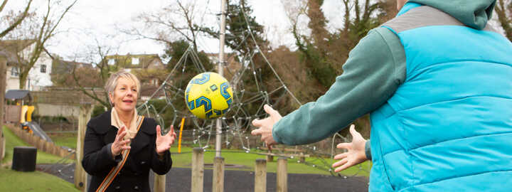 occupational therapist throwing ball to client
