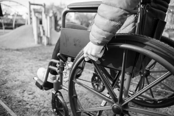 Black and white image of a wheelchair user